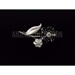 Vintage black and white polka dot “flower” brooch